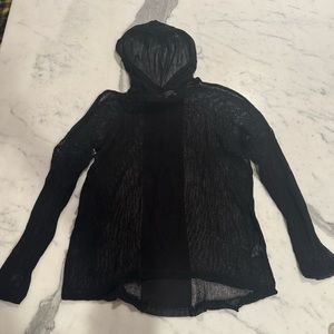 beachy black coverup, see-through, black leather stripe on the back, with hood.